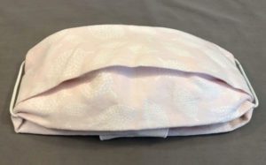 A cloth face mask made from a fabric napkin